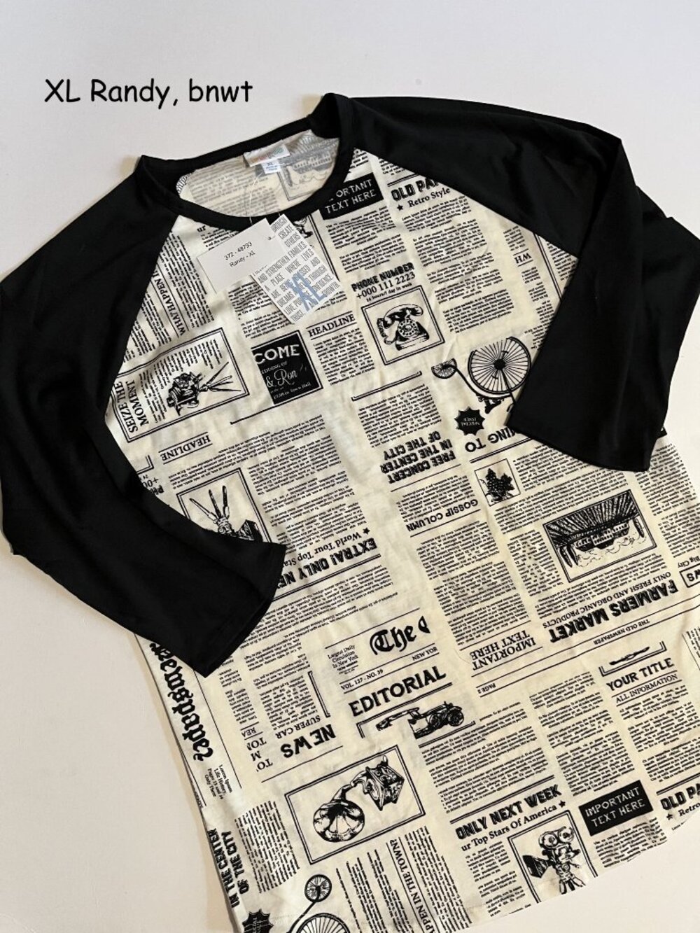 XL Lularoe Randy unisex jersey top, black white newspaper print, black sleeves
